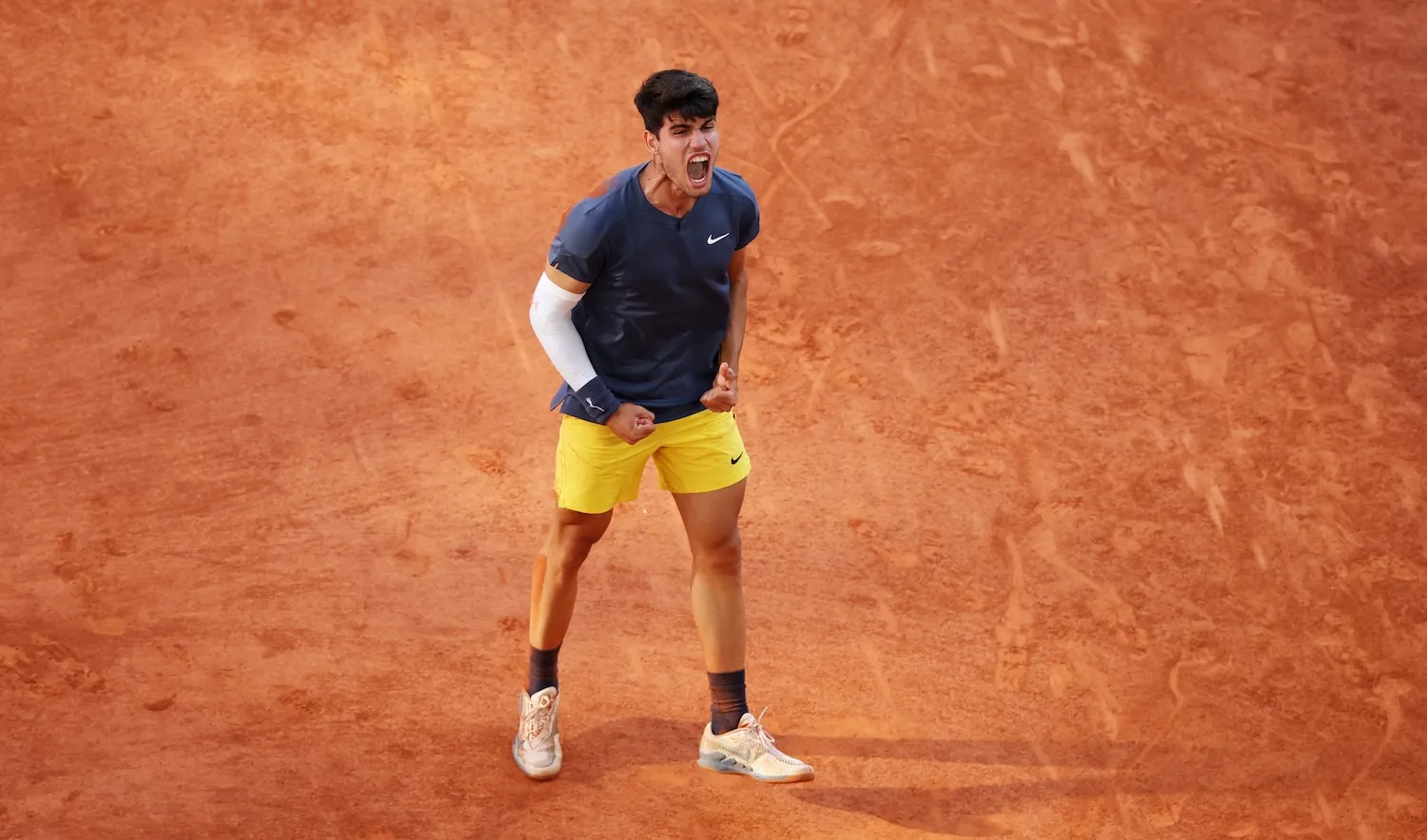 PARIS, FRANCE - JUNE 09: Carlos Alcaraz of Spain celebrates winning match point against Alexander Zverev of Germany during the Men’s Singles Final match on Day 15 of the 2024 French Open at Roland Garros on June 09, 2024 in Paris, France. (Photo by Clive Brunskill/Getty Images)